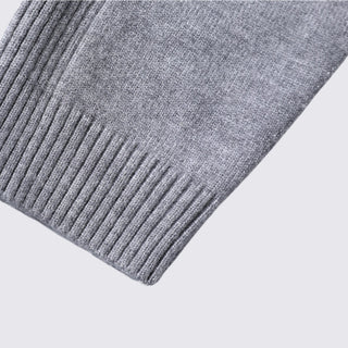 Close-up of a gray knitted fabric on a light gray background