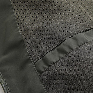 Close-up of a gray jacket with perforated design on a matching fabric background