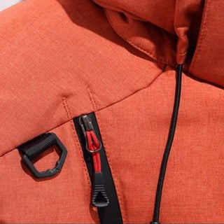 Close-up of an orange jacket with a zipper and hood