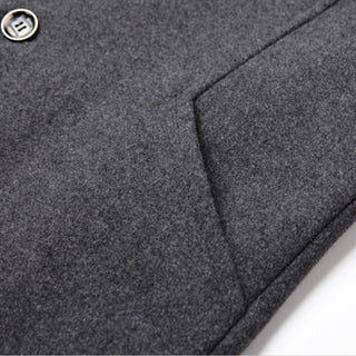 Close-up of a gray textured fabric with a button on a white background