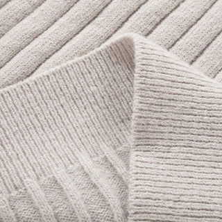 Close-up of textured light gray fabric with a ribbed pattern