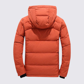 Orange puffer jacket on a light gray background