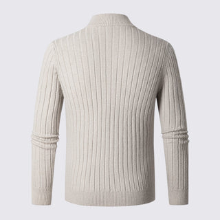 Beige ribbed sweater on a light gray background