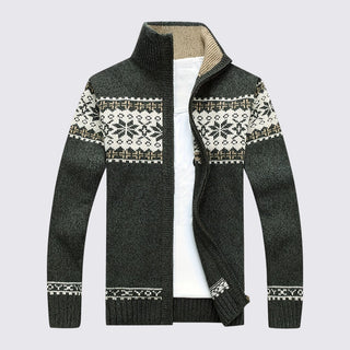 Dark gray sweater with patterned cuffs and hem on a light gray background