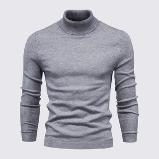 Gray turtleneck sweater on a light gray background