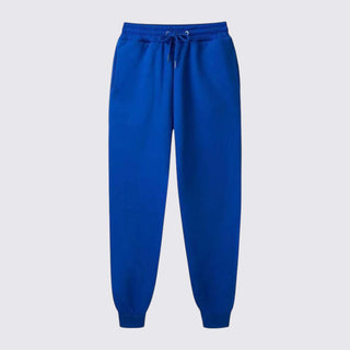 Blue sweatpants on a light gray background