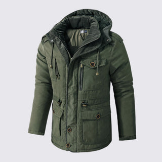 Green winter jacket with multiple pockets and a hood on a light gray background