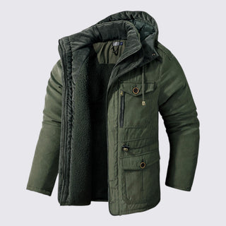 Green winter jacket with a hood on a light gray background