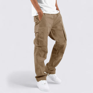 Person wearing beige cargo pants on a white background