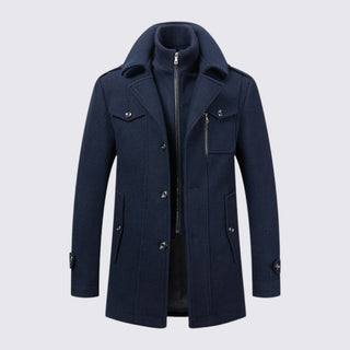 Navy blue coat with buttons and zippers on a light gray background