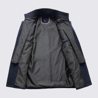 Gray jacket with navy accents on a light gray background