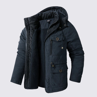 Dark blue winter jacket with fur-lined hood on a light gray background