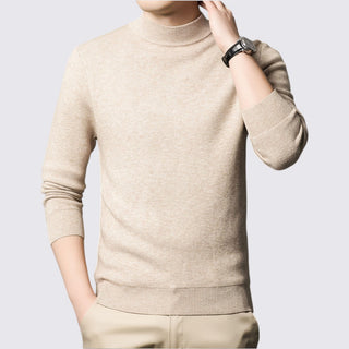 Beige turtleneck sweater worn by a person on a light gray background