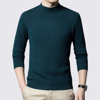 Teal turtleneck sweater worn by a person on a light gray background