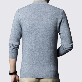 Gray sweater worn by a person on a light gray background