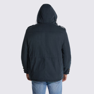 Person wearing a black jacket with a hood on a white background