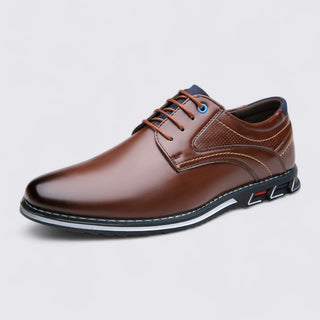 Brown leather shoe on a light gray background