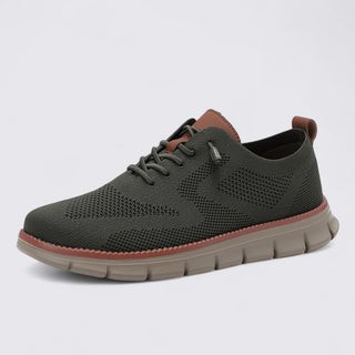 Dark gray sneaker with brown accents on a light gray background