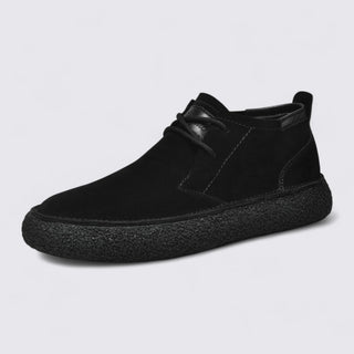 Black shoe on a light gray background